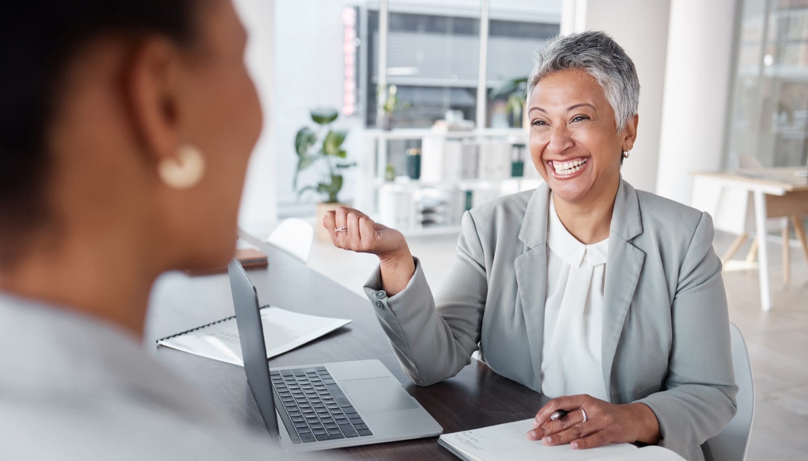 Professional woman smiling during a meeting
